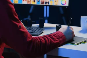photographer-using-graphic-tablet-perform-editing-operations-correct-images-creative-agency